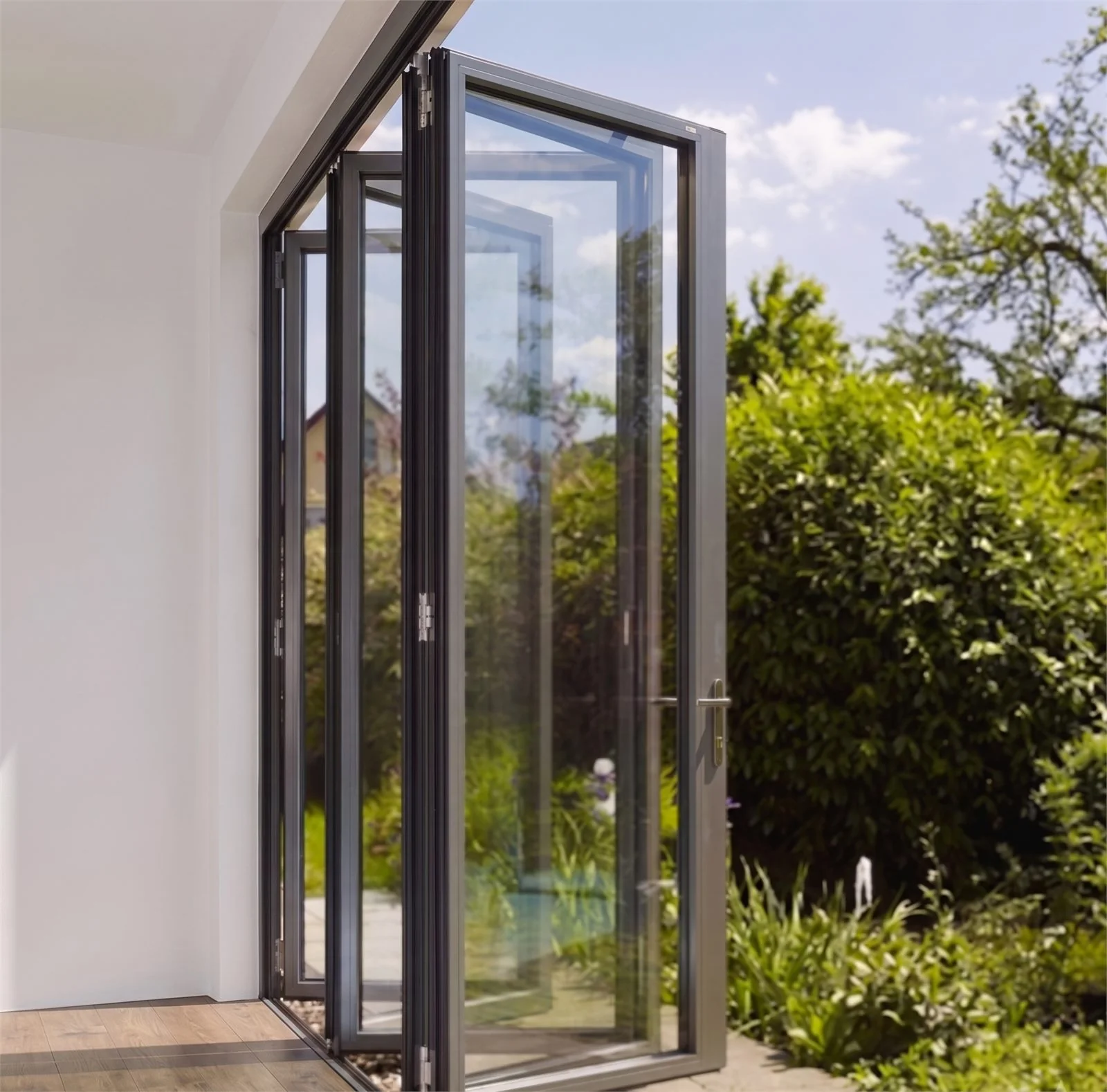 Impact bifold doors open to a Florida garden patio